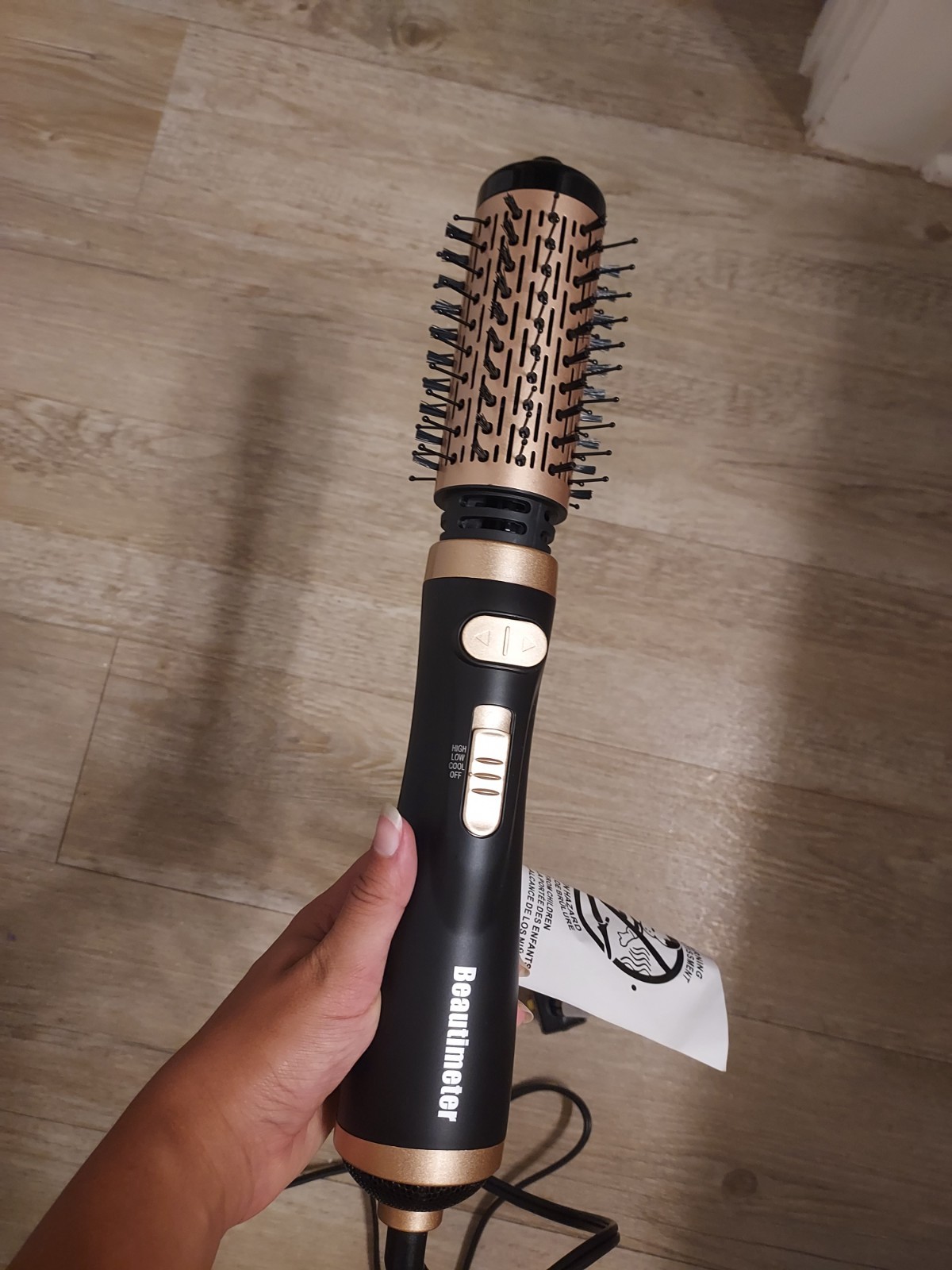 beatuitimeter hair dryer. Can roll in 2 directions and has 2 different sizes.